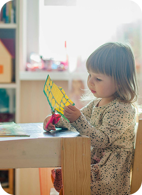 Child playing with educational toys
